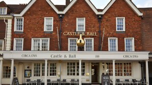 A traditional brick building with a sign reading 'Castle & Ball' and 'CIRCA 1765'. - Castle And Ball by Greene King Inns (Marlborough)
