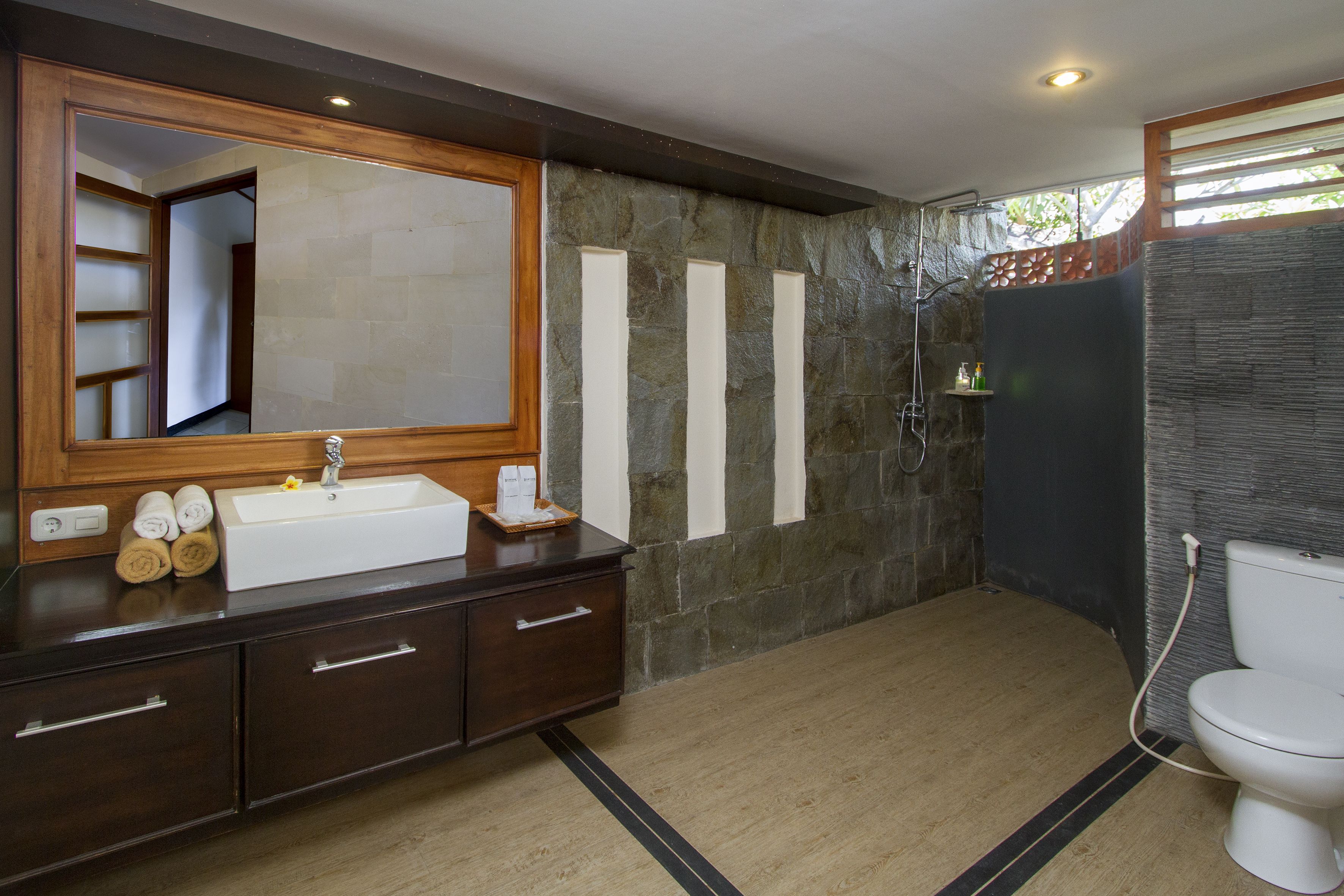 deluxe room | bathroom | slippers, towels