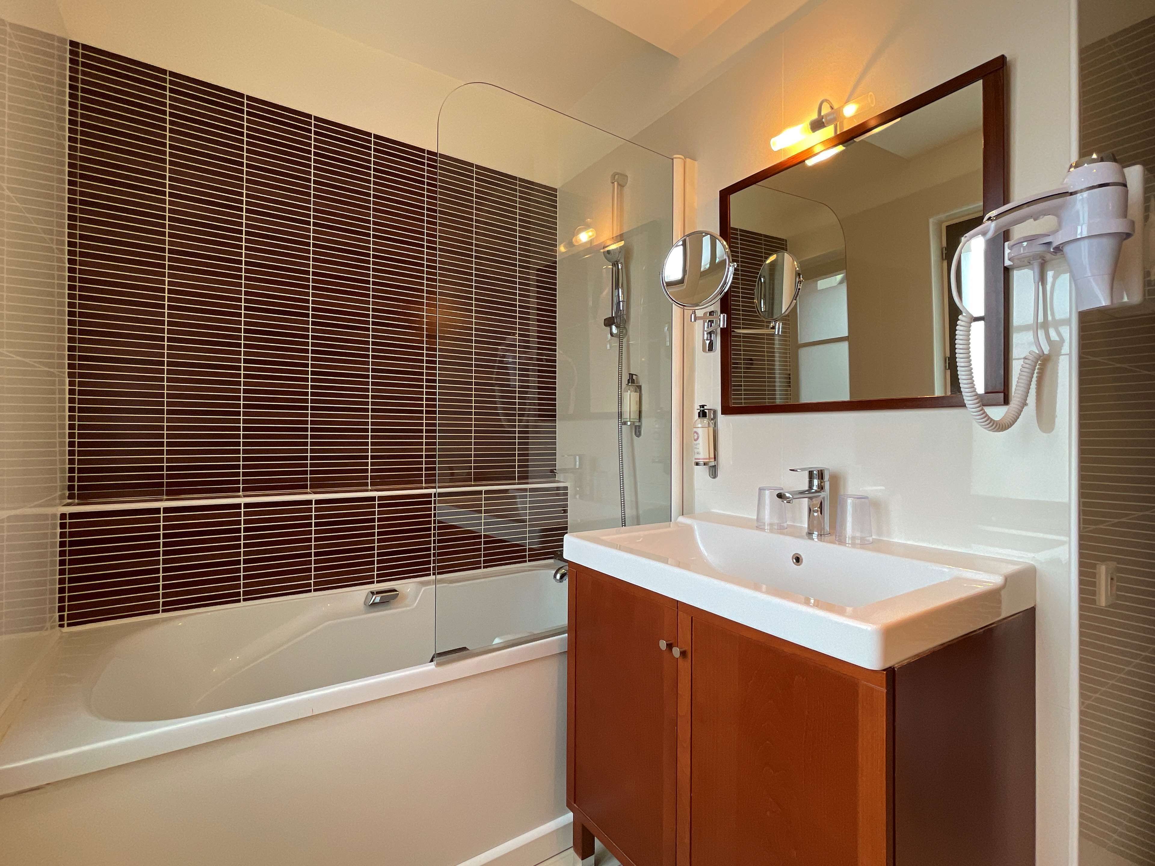 comfort room, 2 single beds, non smoking | bathroom | shower, eco-friendly toiletries, hair dryer, towels