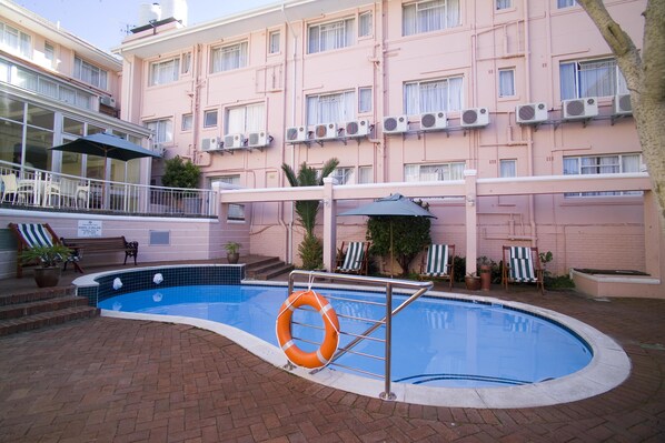 Outdoor pool, pool umbrellas, sun loungers