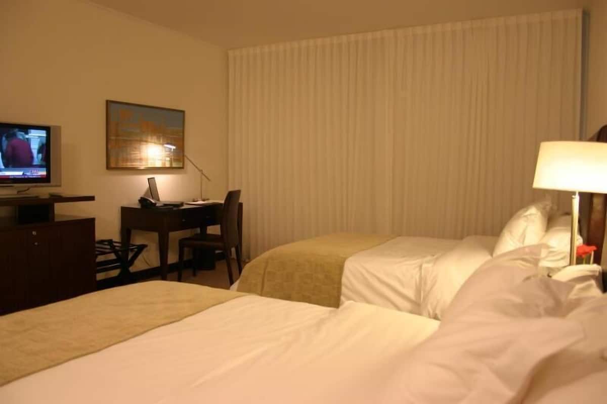 Premium bedding, down comforters, pillowtop beds, minibar