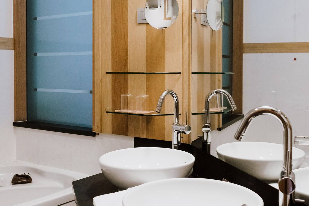 junior suite | bathroom | separate bathtub and shower, jetted bath, rainfall showerhead