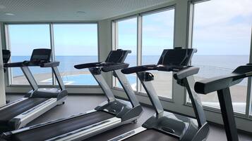 Work out with ocean views at this fitness center, featuring three treadmills with digital displays.