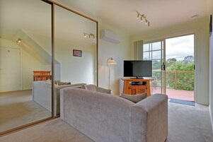 Standard Studio, Non Smoking, Kitchenette (Loft Studio) | Living area | Flat-screen TV