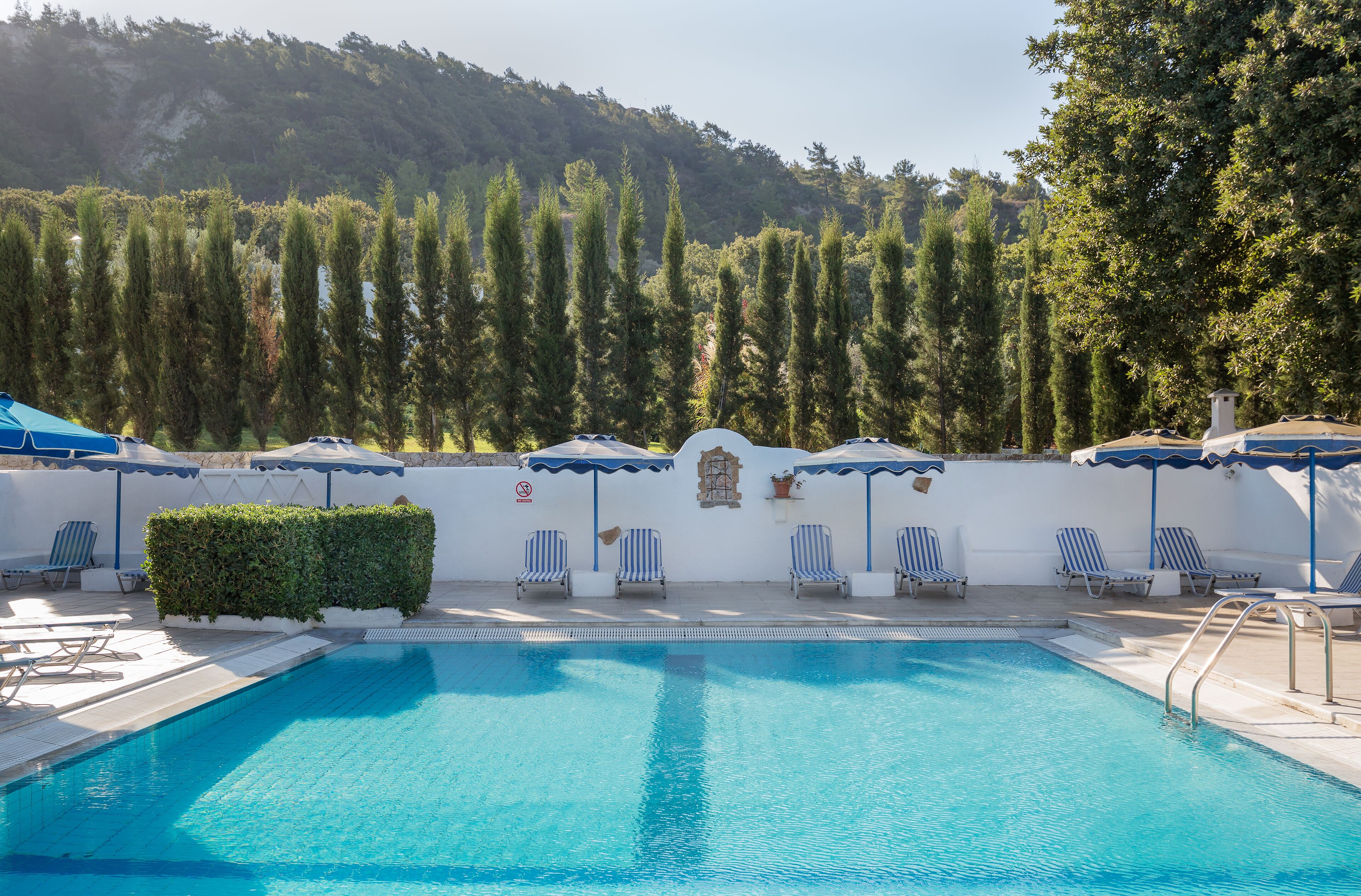 outdoor pool, pool umbrellas, pool loungers