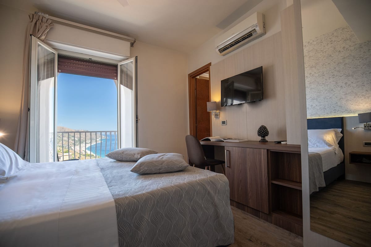 Deluxe Double or Twin Room, Balcony, Sea View | Minibar, in-room safe, desk, laptop workspace