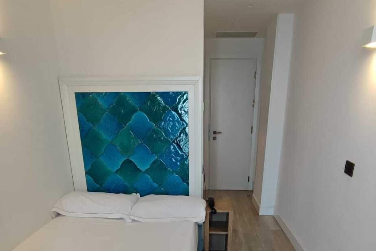 Basic Single Room, 1 Twin Bed, Balcony, Sea View | Minibar, in-room safe, desk, laptop workspace