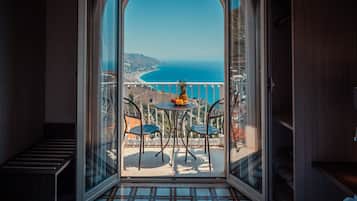 Deluxe Double Room, Terrace, Sea View | Minibar, in-room safe, desk, laptop workspace