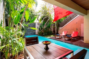 Outdoor pool, pool umbrellas, pool loungers