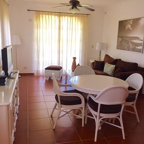 Apartment, 1 Bedroom | Living room | TV - The Golf Suites (Punta Cana)