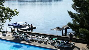 Indoor pool, outdoor pool, open 9:00 AM to 10 PM, pool umbrellas