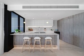 3 Bedroom Deluxe Apartment | Private kitchen | Full-size fridge, microwave, oven, stovetop