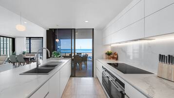 3 Bedroom Deluxe Apartment | Private kitchen | Full-size fridge, microwave, oven, stovetop