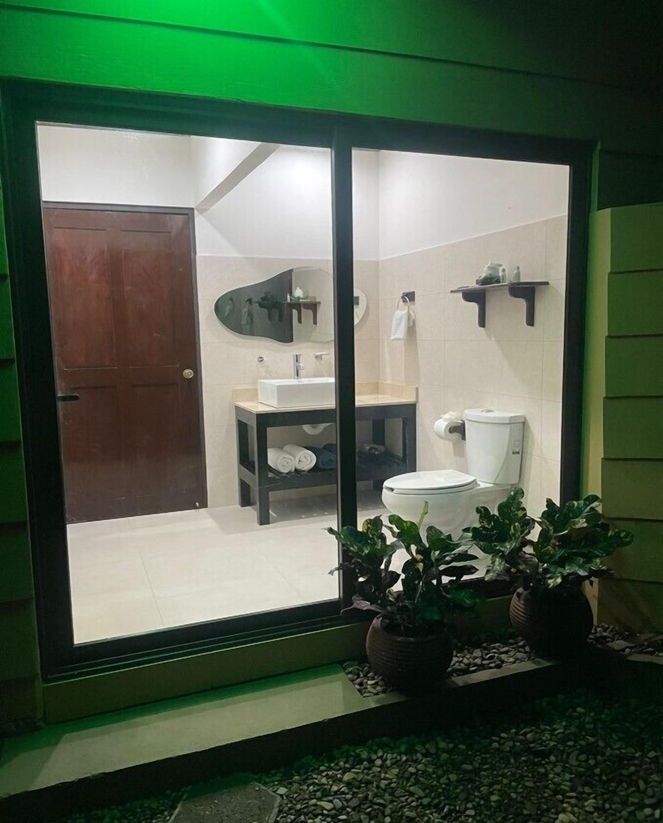 deluxe room, 2 queen beds | bathroom | shower, free toiletries, hair dryer, towels