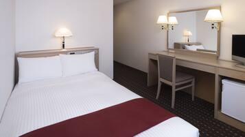 A hotel room with a bed, a desk, a chair, a television, and a mirror.