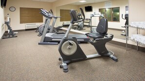 A gym with treadmills, an elliptical, and a mirrored wall. - Holiday Inn Express Hotel & Suites Las Vegas by IHG (Las Vegas)