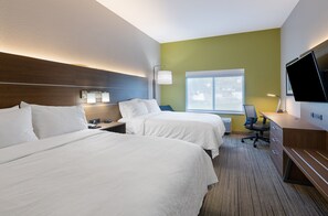 A hotel room with two beds, a desk, a chair, a TV, and a window. - Holiday Inn Express Hotel & Suites Weston by IHG (Weston)