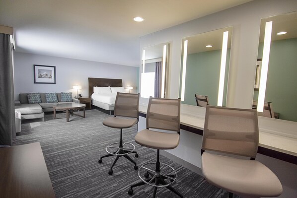 Deluxe Studio, 1 King Bed | Living area | 42-inch LCD TV with cable channels, TV, pay movies