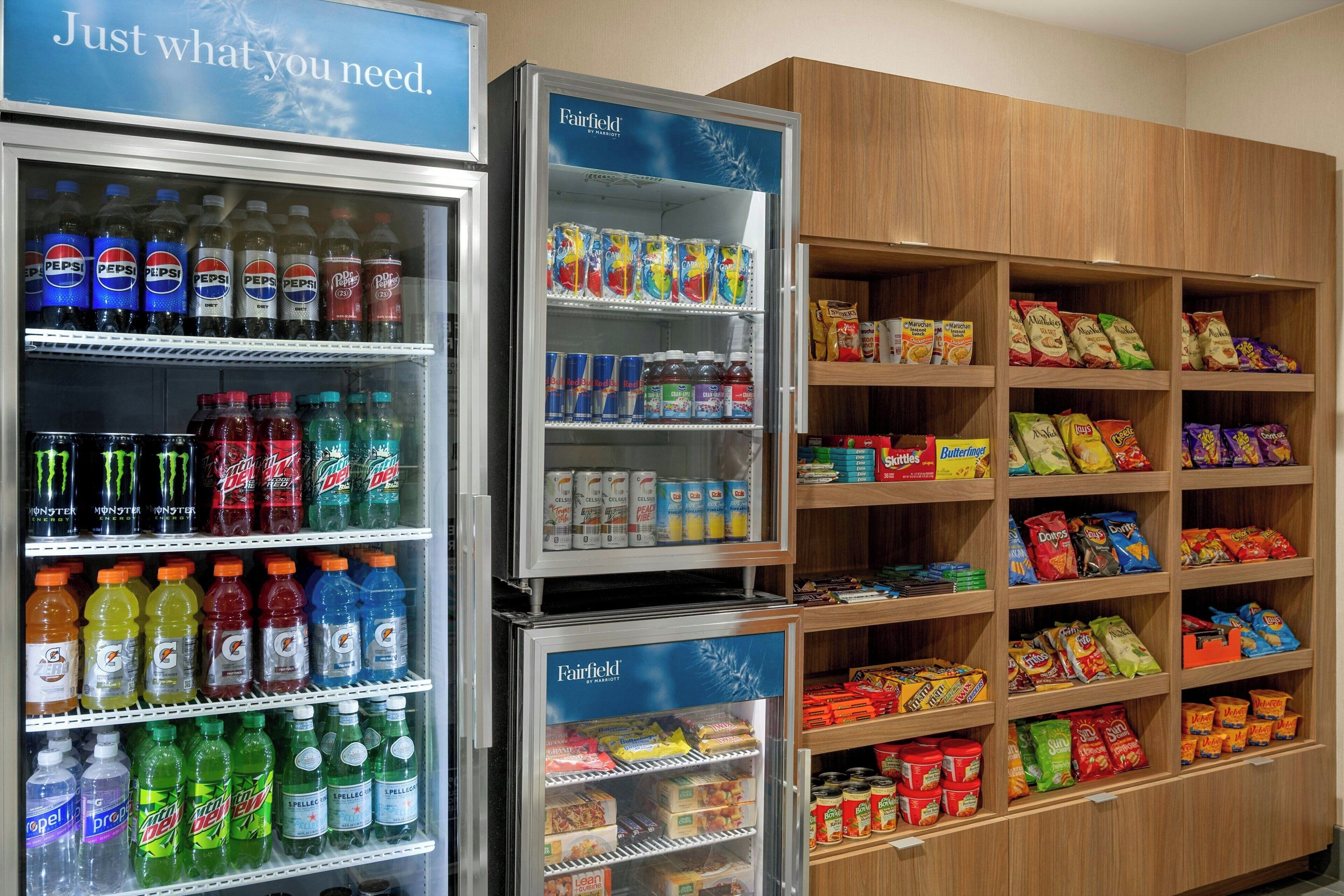 A vending machine stocked with various beverages and snacks, including Pepsi, Mountain Dew, and Doritos.