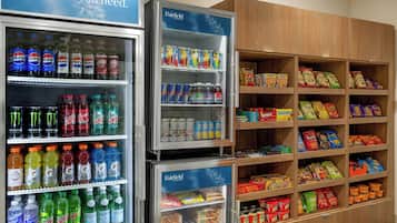 A vending machine stocked with various beverages and snacks, including Pepsi, Mountain Dew, and Doritos.