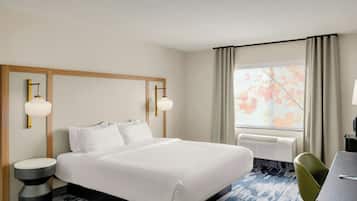 Premium bedding, pillow-top beds, desk, laptop workspace