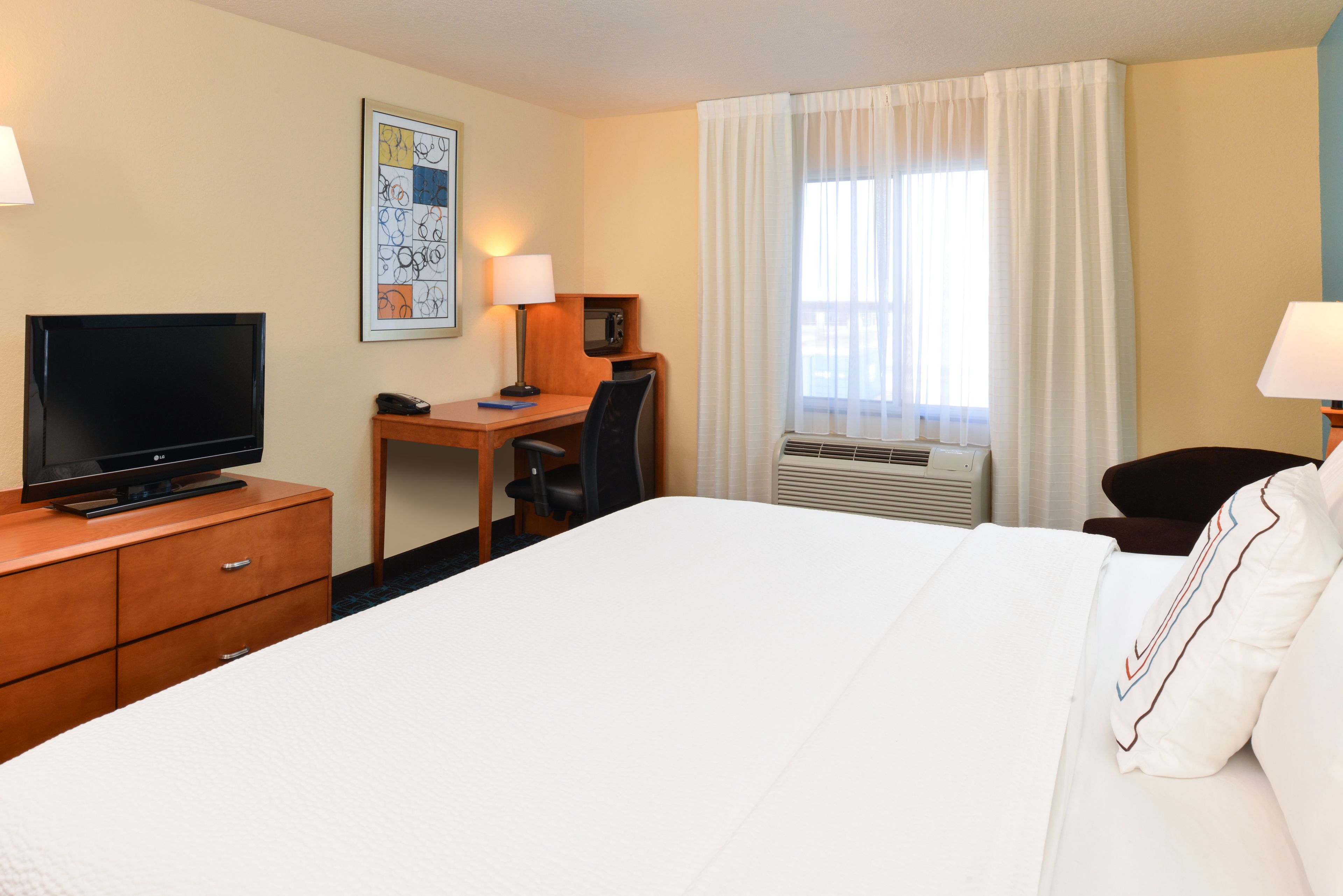 Premium bedding, pillowtop beds, desk, laptop workspace