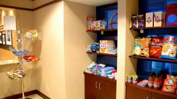 A snack bar with various packaged foods and condiments.