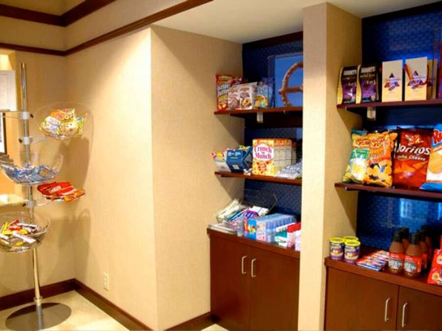 A snack bar with various packaged foods and condiments.