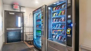 A vending machine area with a water dispenser and a snack vending machine.