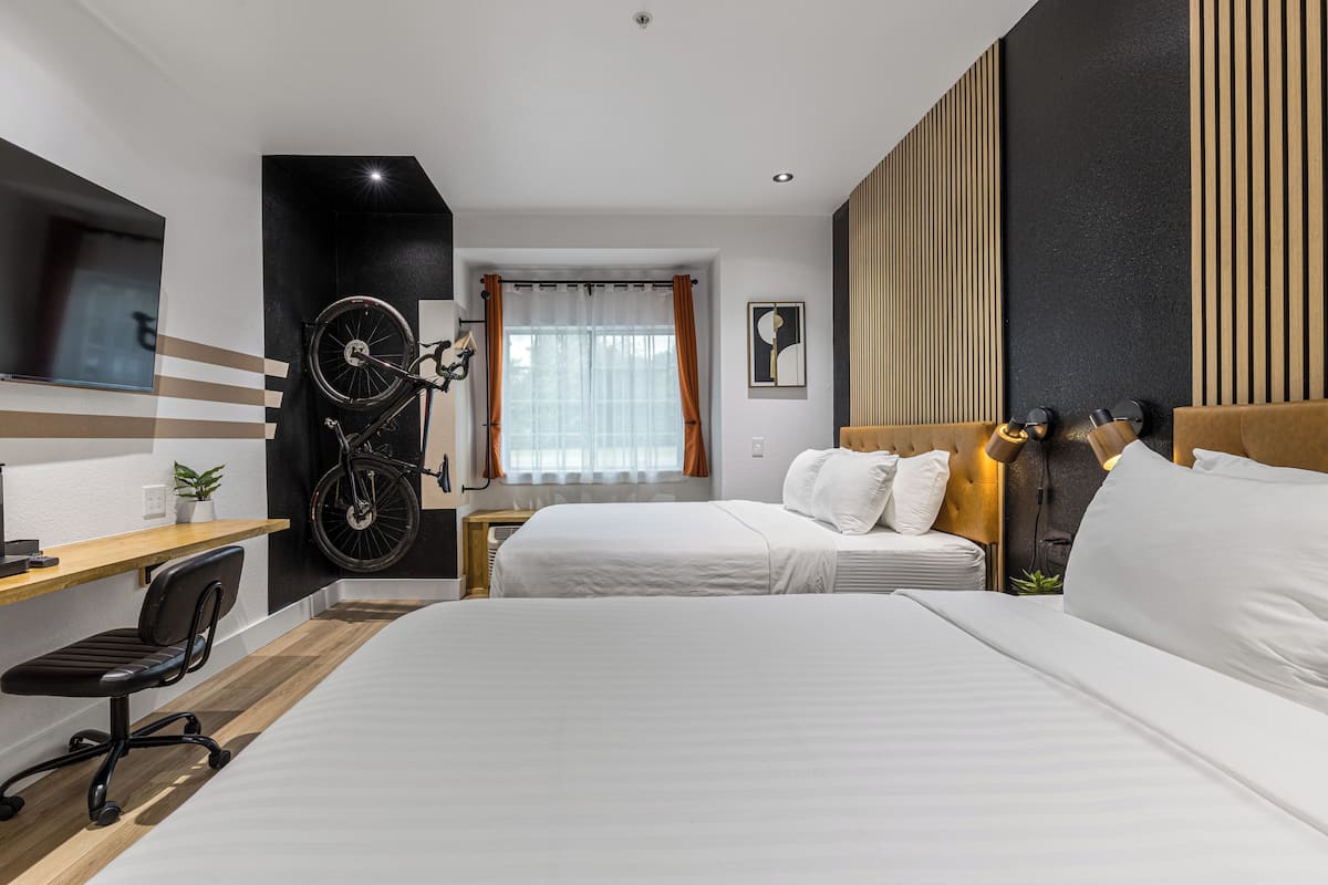 Premium bedding, desk, laptop workspace, blackout drapes