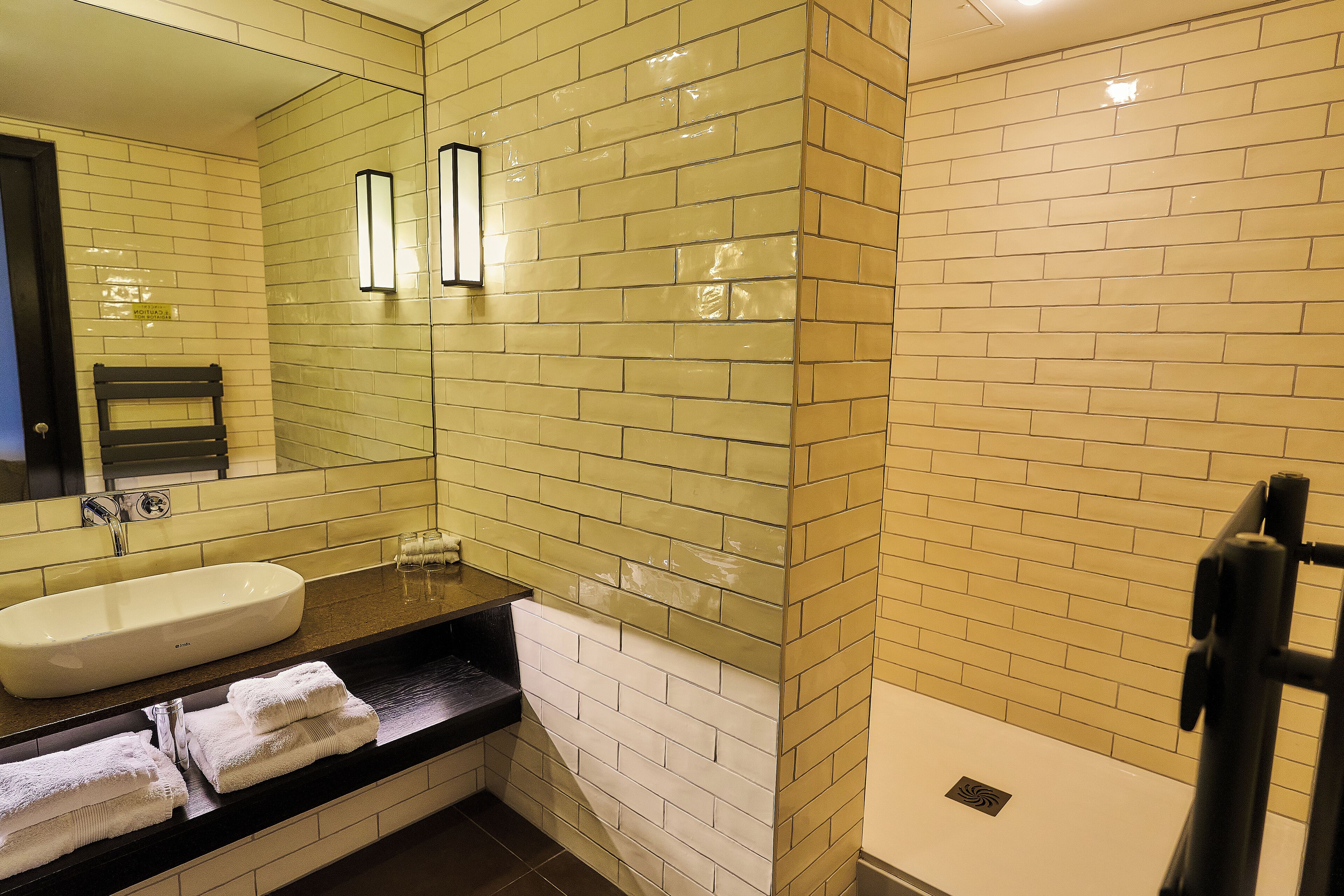 corner studio | bathroom | designer toiletries, hair dryer, bathrobes, soap