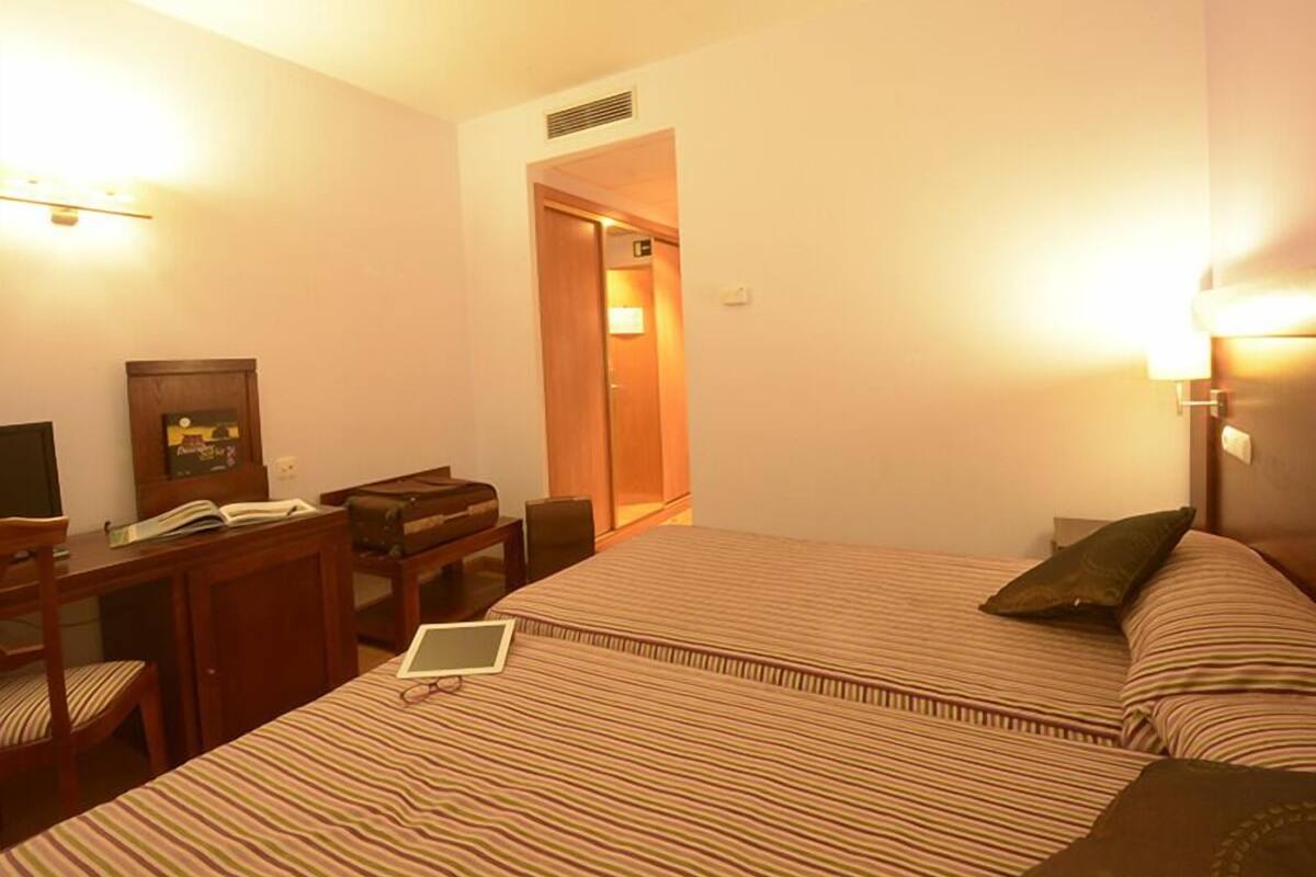 Desk, blackout curtains, cots/infant beds, rollaway beds