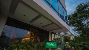A modern building with large windows and a green sign. - Royal Orchid Central Jaipur (Jaipur)