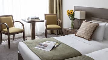 Premium bedding, down comforters, minibar, in-room safe