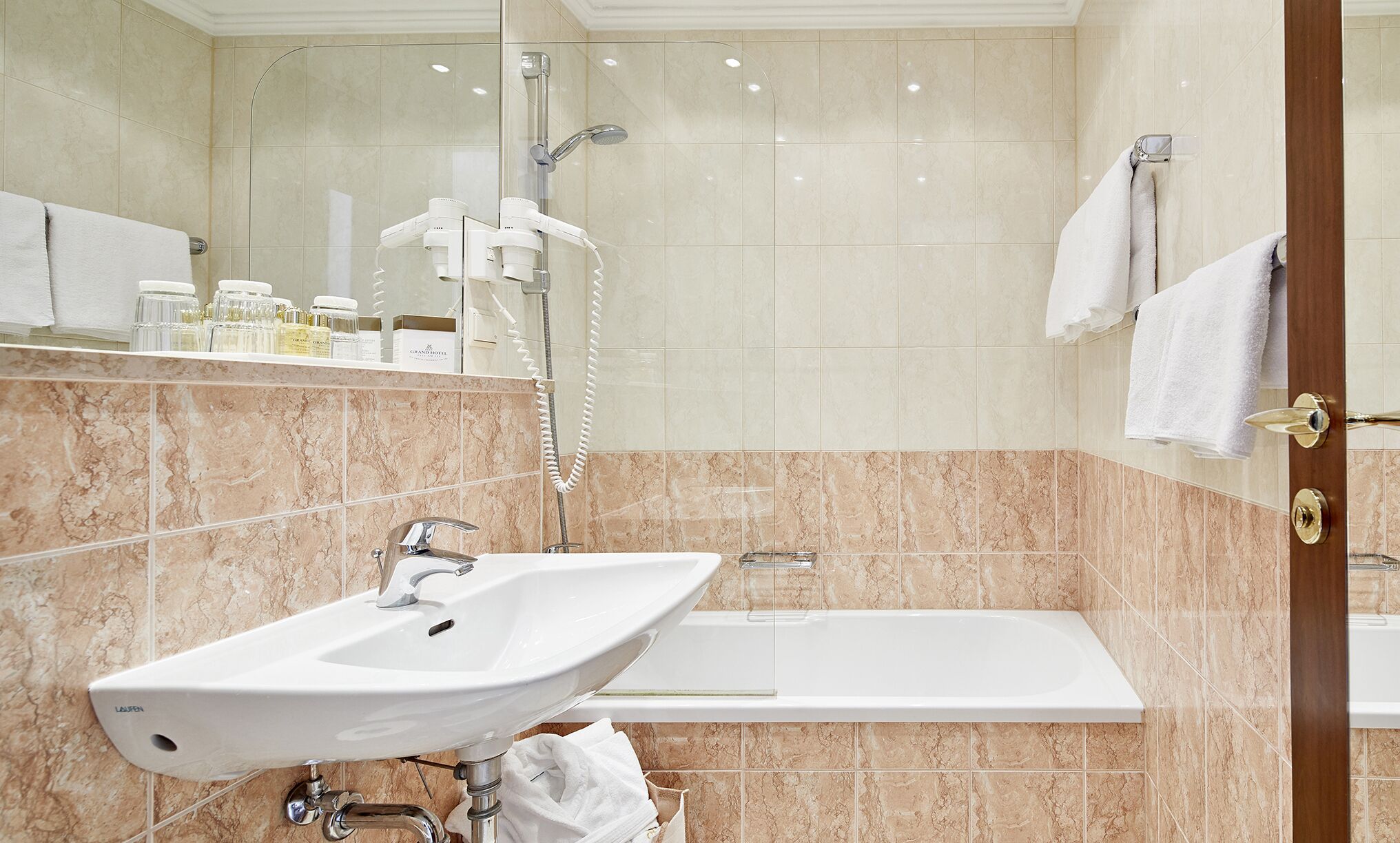 A bathroom with a sink, a shower, and a bathtub.