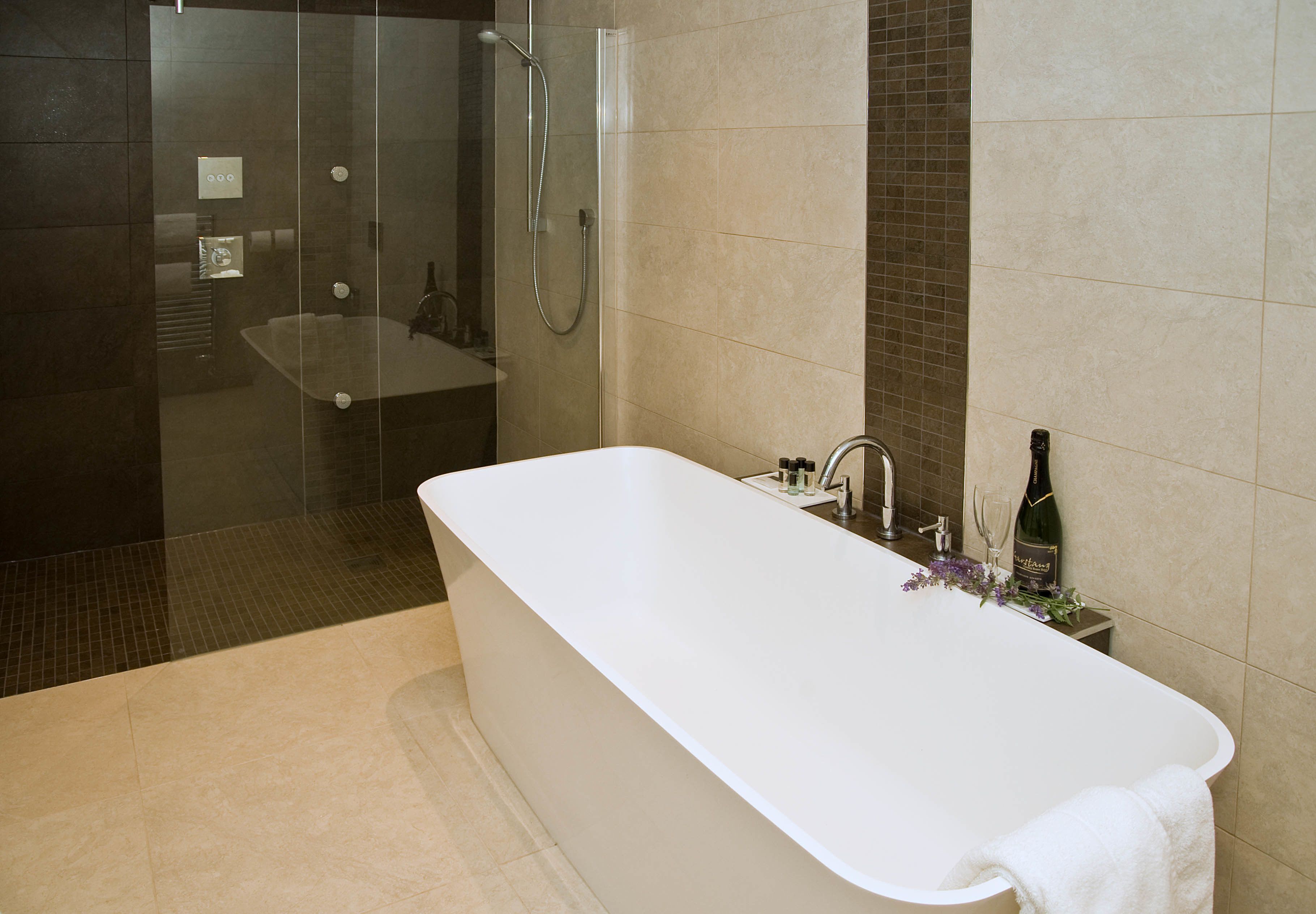 luxury suite, 1 king bed, non smoking (walk-in shower) | bathroom | free toiletries, hair dryer, towels
