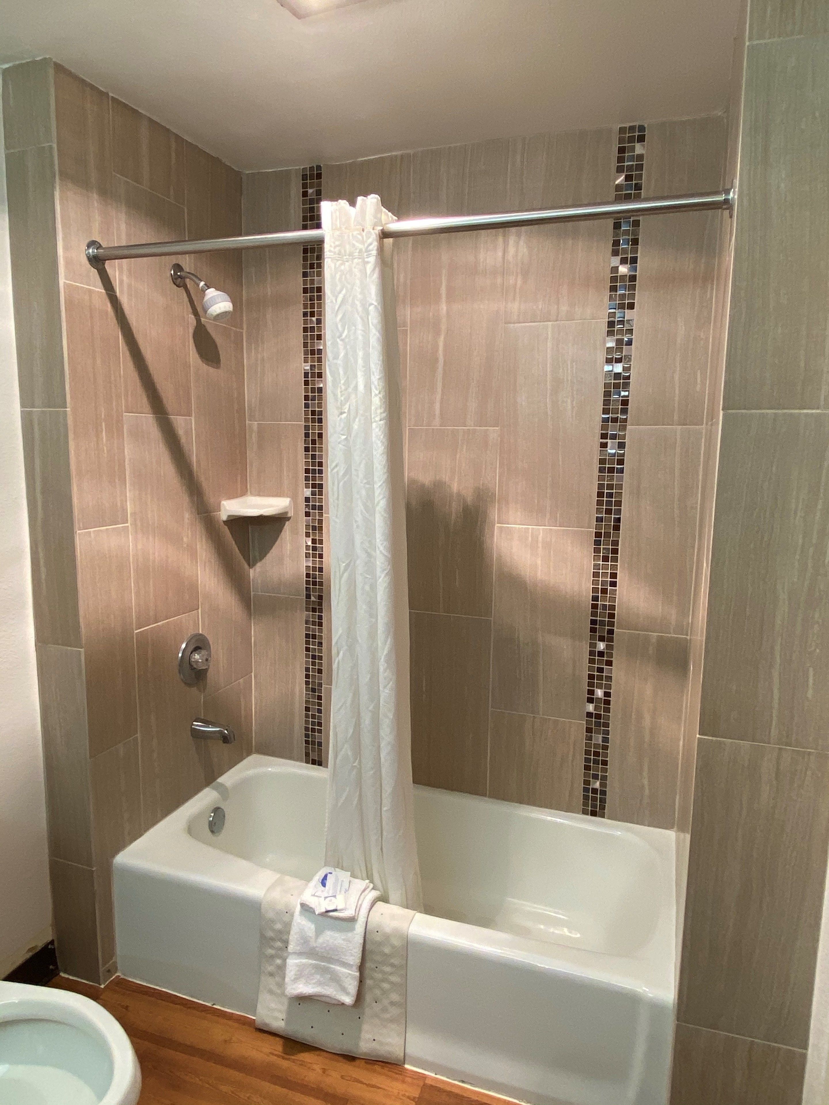 combined shower/bathtub, free toiletries, hair dryer, towels