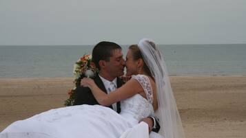 Celebrating love on a serene beach with breathtaking ocean views.