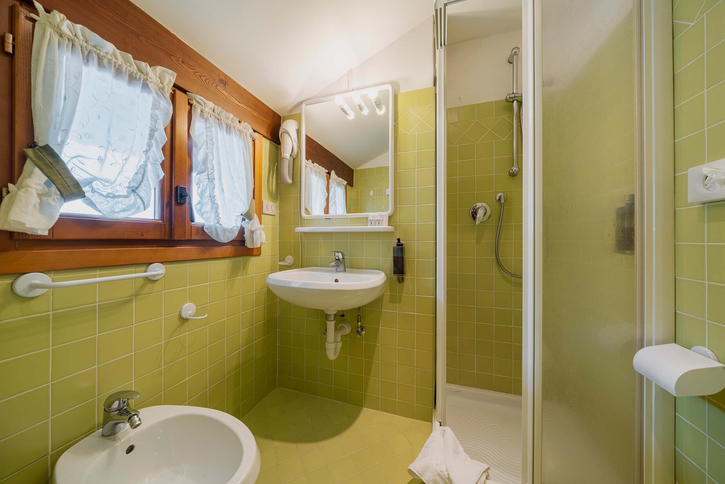 economy double room | bathroom | hair dryer, towels