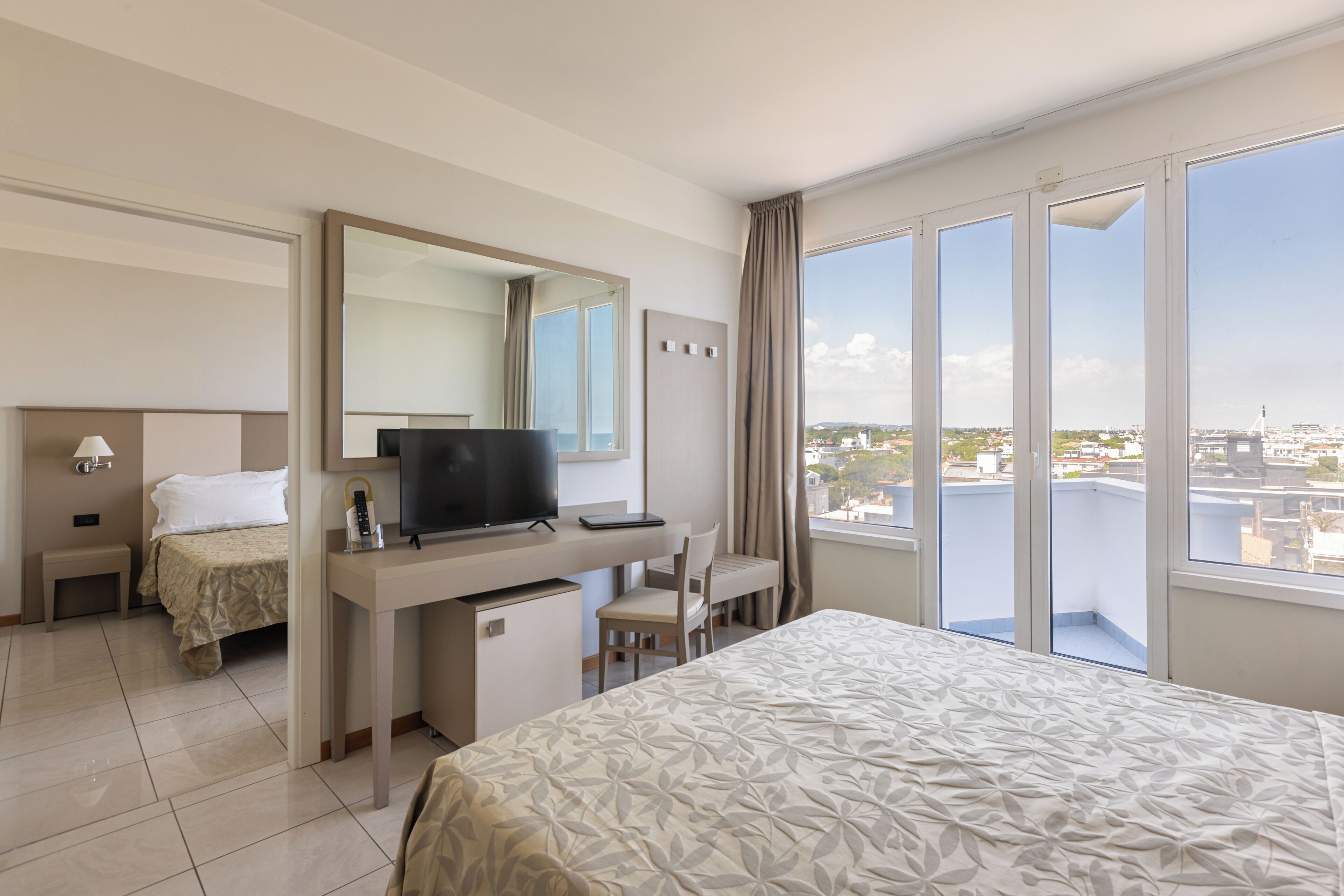Family Room, City View | Minibar, in-room safe, desk, blackout curtains