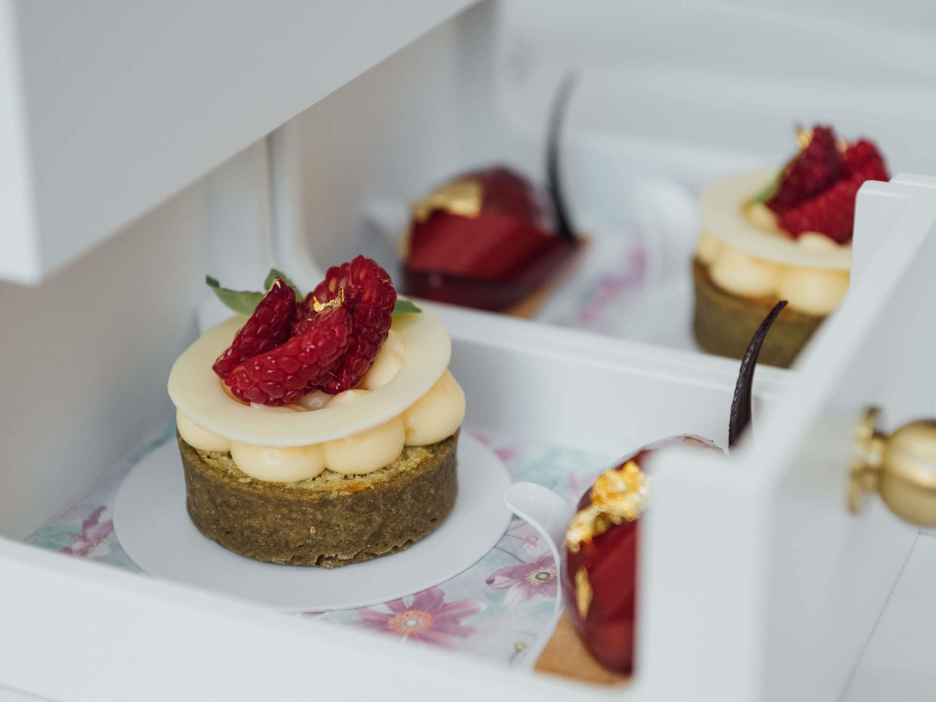 A dessert with raspberries on a plate.