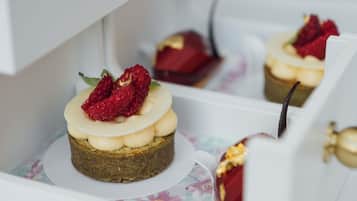 A dessert with raspberries on a plate.