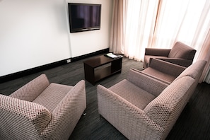 Deluxe Two Bedroom Apartment (Bedrooms on 2nd Floor) | Living area | 80-cm Smart TV with digital channels - St Ives Apartments (Battery Point)