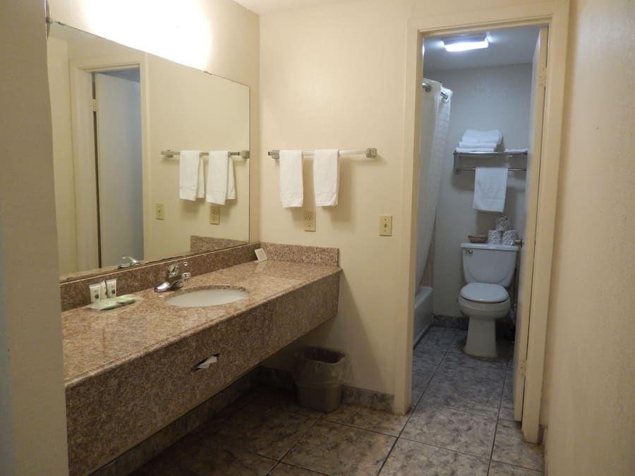 Standard Room, 2 Queen Beds | Bathroom | Combined shower/bathtub, free toiletries, hair dryer, towels
