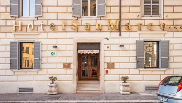 Hotel San Marco with a classic facade, large windows with shutters, and a welcoming entrance. - Hotel San Marco (Rome)