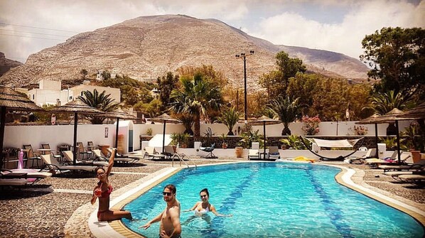 Outdoor pool, pool umbrellas, sun loungers