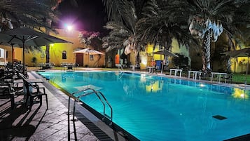 Outdoor pool, open 11:00 AM to 7:00 PM, pool umbrellas, sun loungers