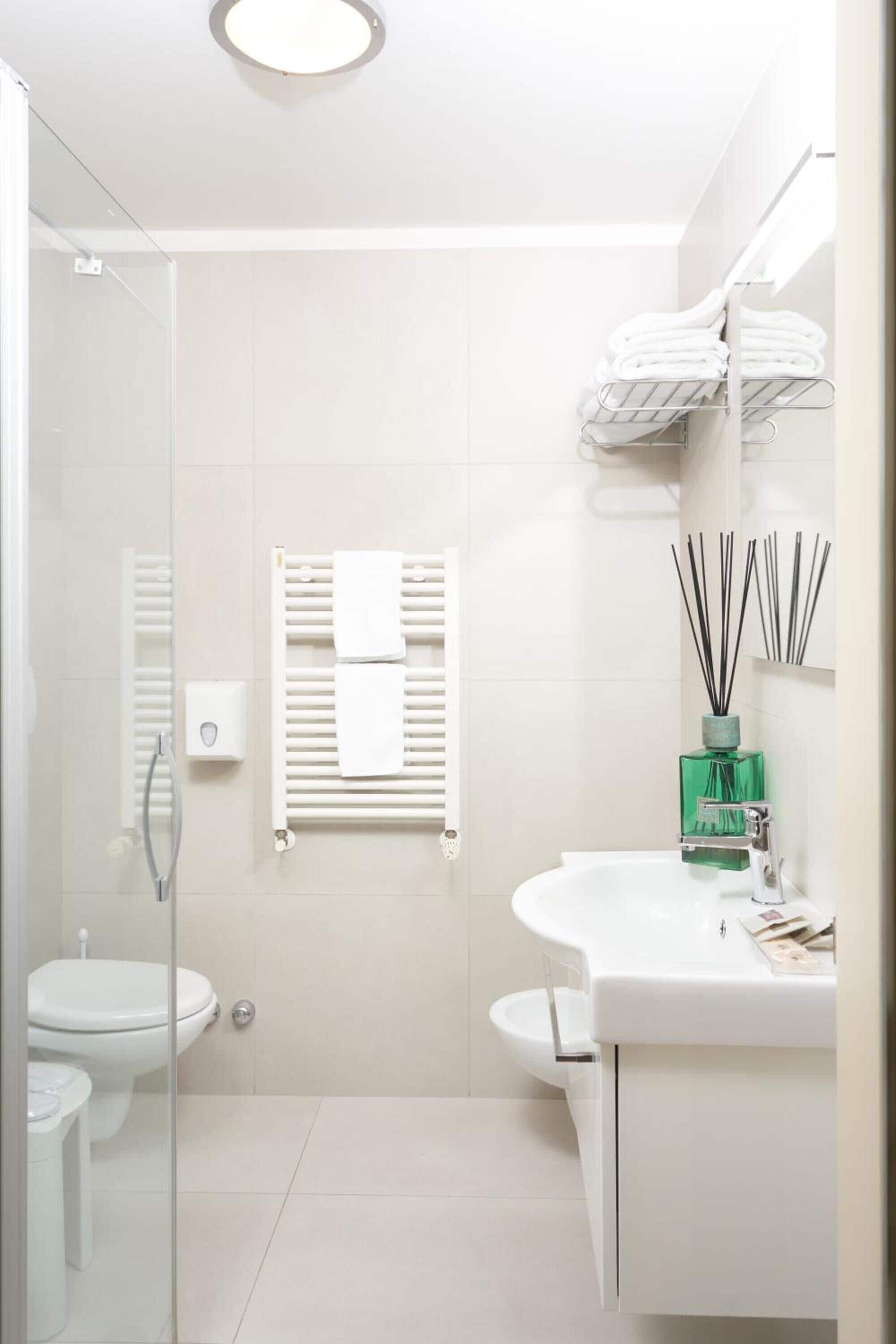 shower, hair dryer, slippers, bidet