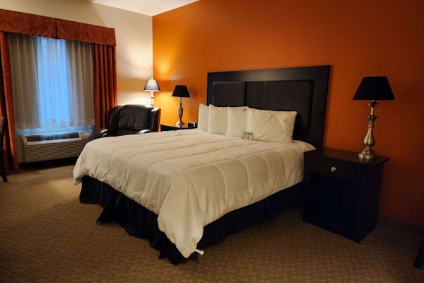 Premium bedding, desk, laptop workspace, blackout curtains