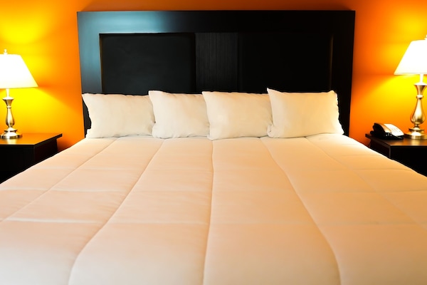 Premium bedding, desk, laptop workspace, blackout curtains